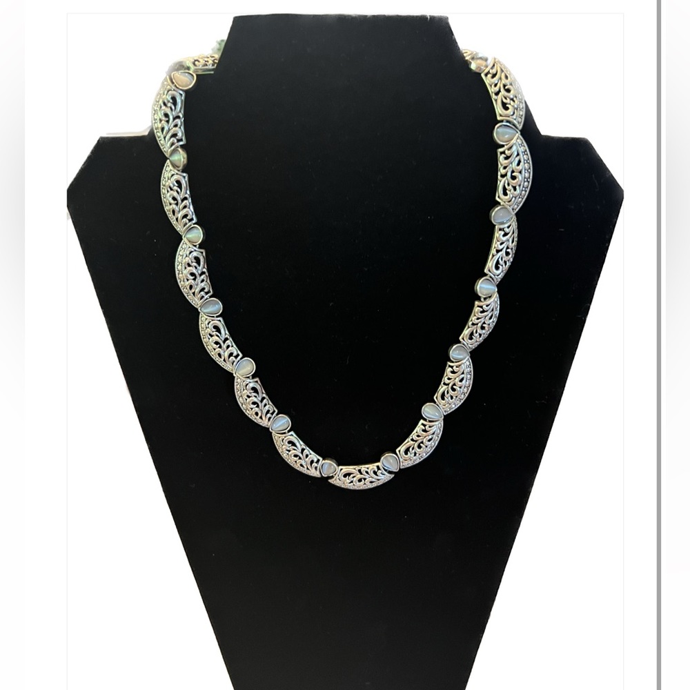 Avon Beautiful Silvertone necklace set with white stones.